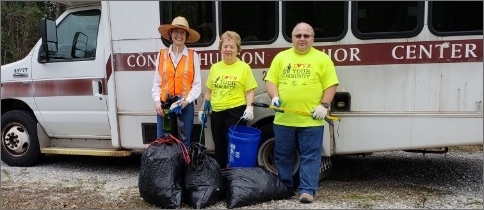 Three citizens involved in community cleanup