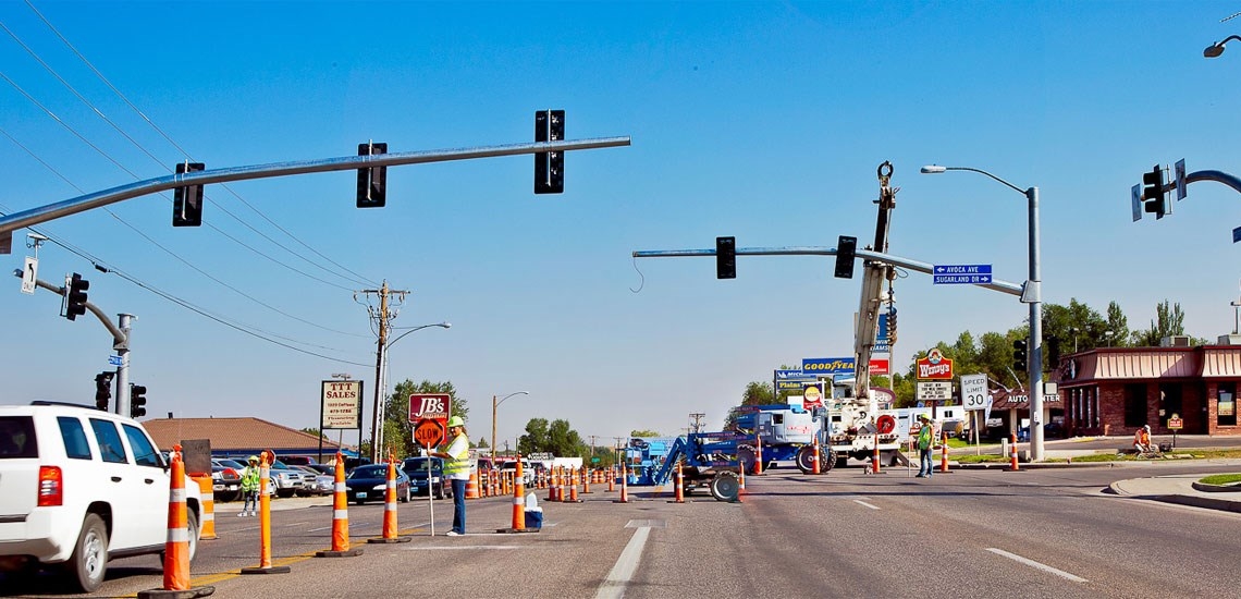 photo of construction workers on a highway